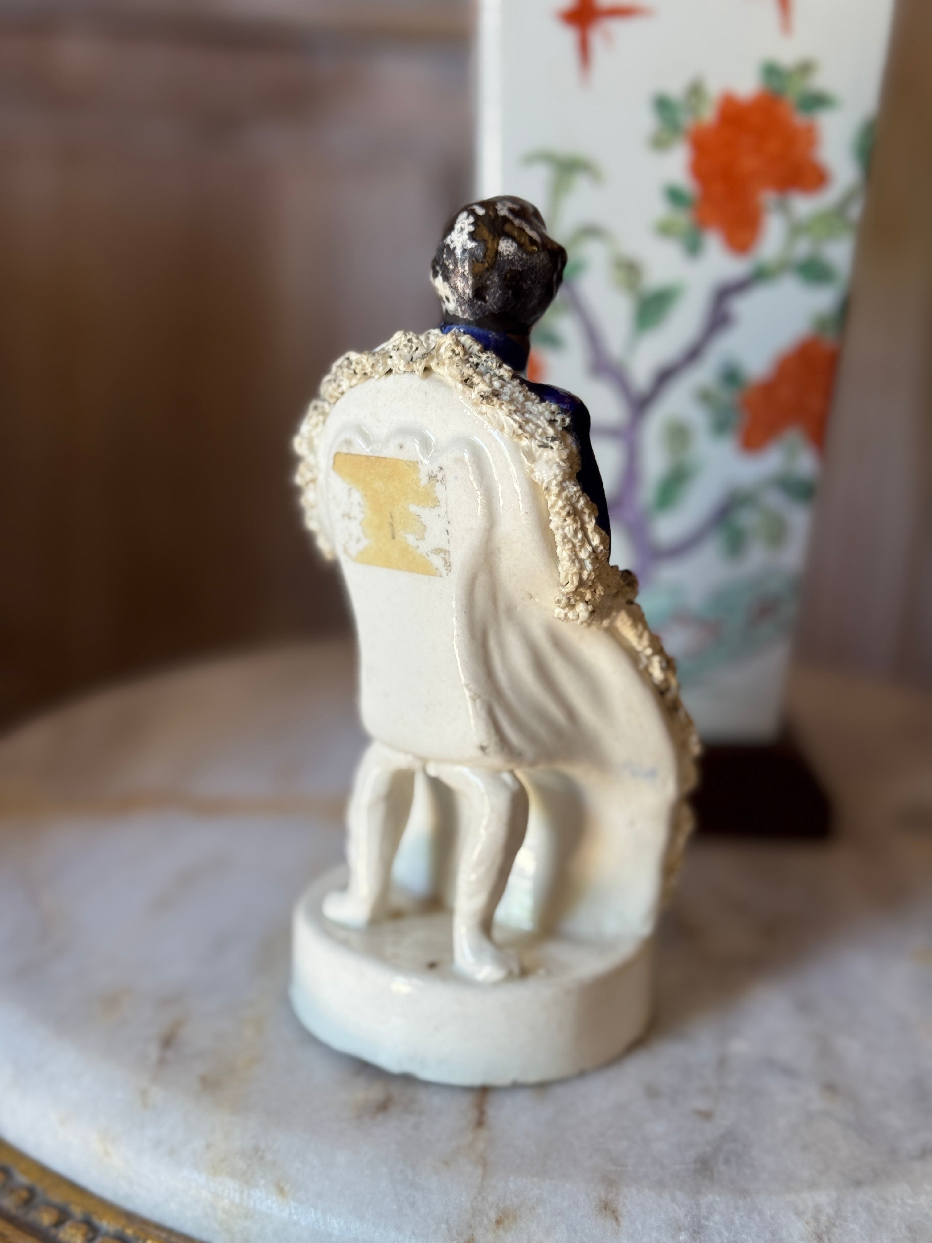 Antique Staffordshire Figurine – Seated Gentleman in Blue Coat